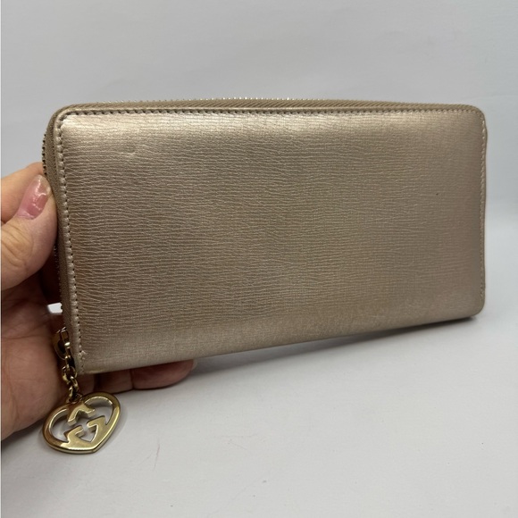 Gucci Handbags - Gucci Metallic Gold Zip-Around Wallet